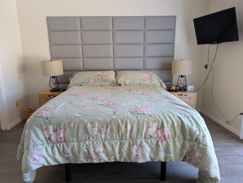 bed with headboard in bedroom